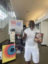 FM member Joseph with his library book