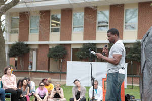 Poet Ambassador Anthony reads a poem at an event