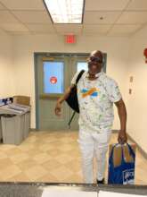 Kelvin picks up a laptop from Free Minds for work