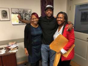 FM Apprentice Craig is gifted a book by FM Staff