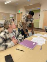 Member Deangelo talking with a Gateway student
