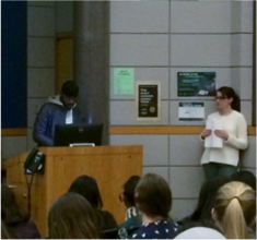 Ricardo speaks to volunteers at Write Night