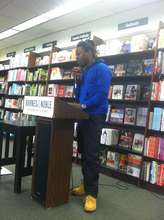 Anthony reads a Free Minds poem at a bookstore