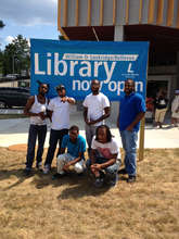 FM members sharing poetry at a library opening