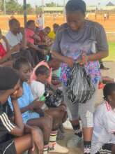 Handing out the hygiene kits