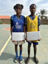 Girls receive their laptops