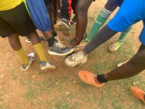 Some of the girls display  their shoes