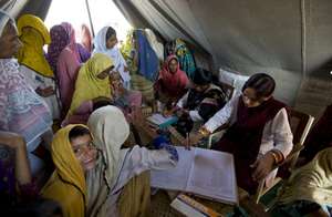 People receiving medical care, Photo: Julie Denesh