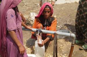 Pakistani Woman Receiving Clean Water