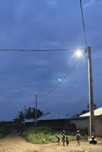 Children playing under streetlight