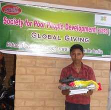 J.Rajkumar receiving his educational materials