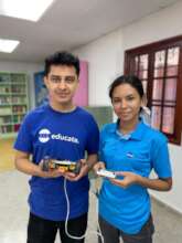 Youth leaders Javier and Shelsy doing robotics