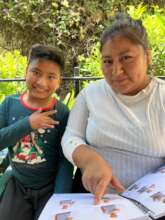 Jacobo and his mother, Gaby, using the LSM Manual