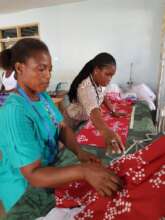 Barbara instructing seamstress on new item