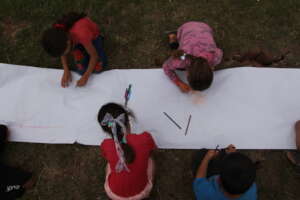 Children coloring in the IACC garden.