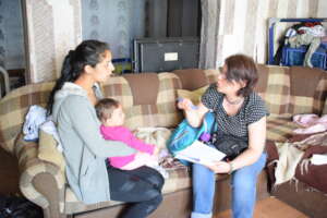 NFP home visitor visits a family