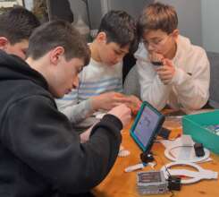 Our students help the pupils assemble a robot