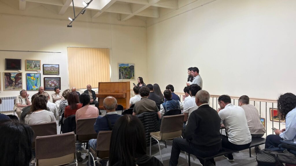 Student reading a poem at the literary event