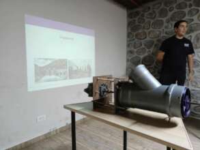 The student shows their small hydropower project