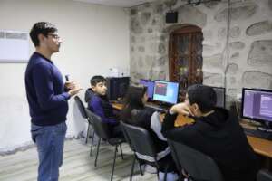 A senior student leads the class