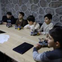 Robotics course end: students with their robots