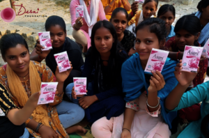 Girls holding Asani Sanitary Pads