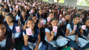 Girls holding Asani Sanitary Pads