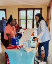 Stacey engaging guests at the Symposium