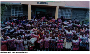 Children with their warm Christmas blankets