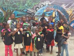 Some of the kids showing off the school bags