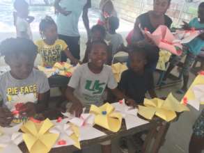 The kids also learn how to make paper decorations