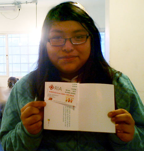 Miriam receiving her scholarship
