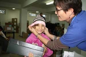 Girl gets new winter hat to accompany new boots