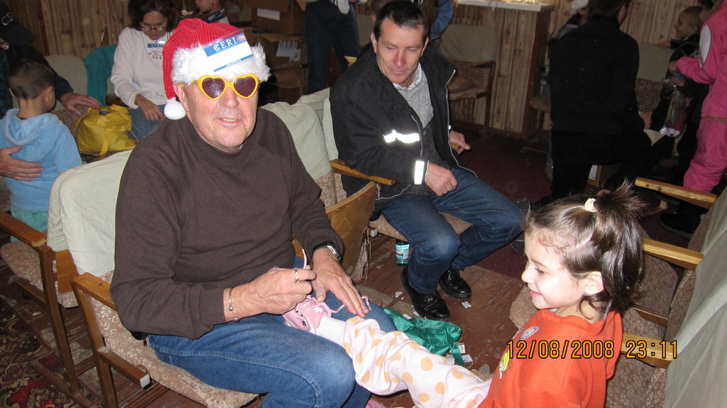 CERI Volunteers Fit Boots on Children's Feet