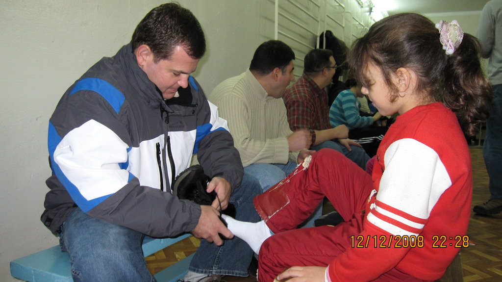 CERI Volunteers Fit Boots to Children's Feet
