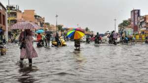 Commuters in floodwater