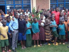 Father Emmanuel with street children at Muko.