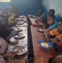 Street children enjoying a meal at Muko School.
