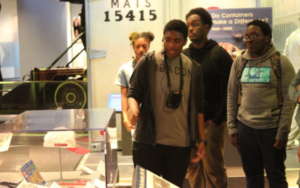 Max, a HS junior, leads peers on a museum tour