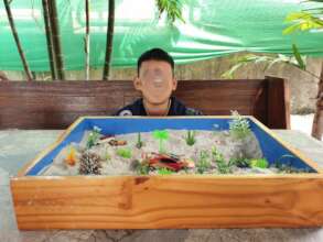 A child with the sand play after a therapy session
