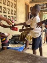 Boy receives his food