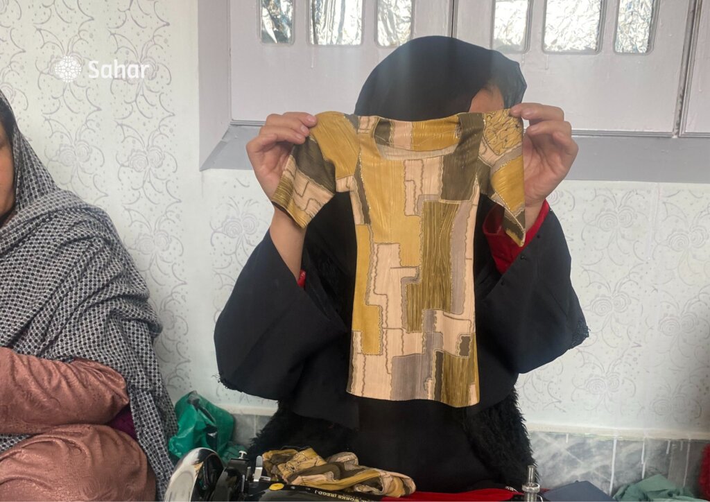 Participant shows finished garment