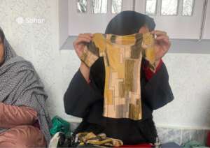 Participant shows finished garment