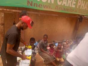 Our team member sharing food items to poor women