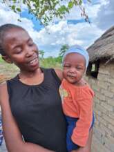 A breastfeeding baby with mother