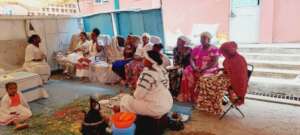 partial of  young women when they supportd bv MHO