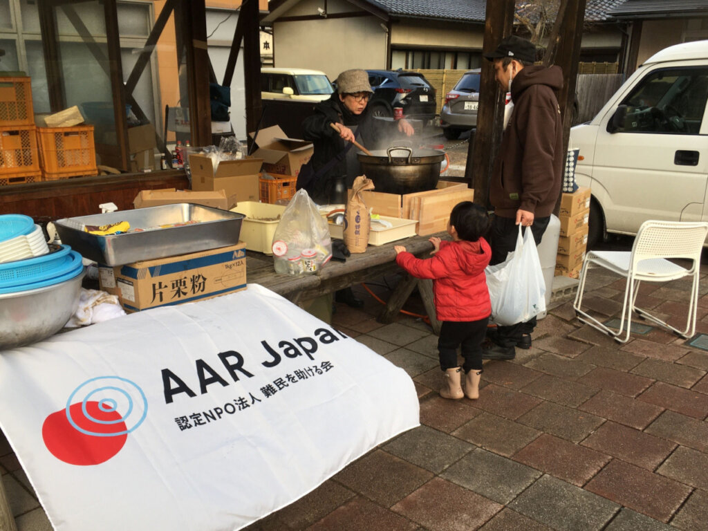 Residents lining up for a soup kitchen