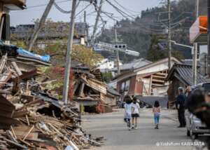 Children walking through an affected town