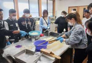 Participants making tokoroten