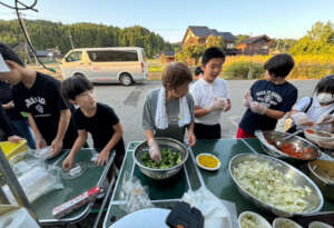 Neighborhood children help with the soup kitchen